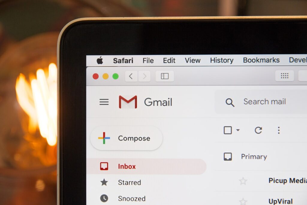 Gmail interface on laptop screen showing email communication
